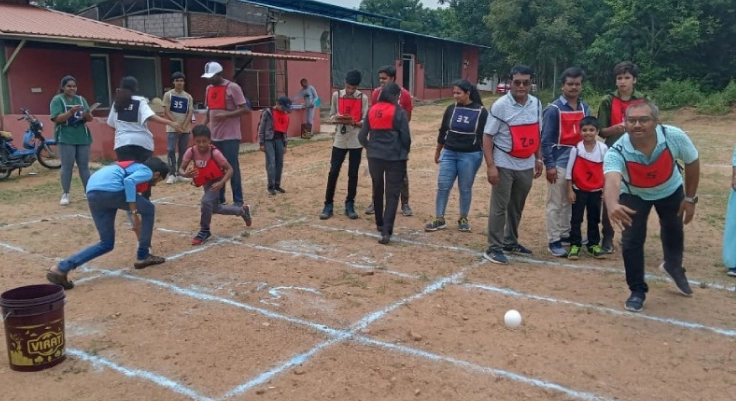 A team of individuals having fun together by engaging in an outdoor activity with great enthusiasm