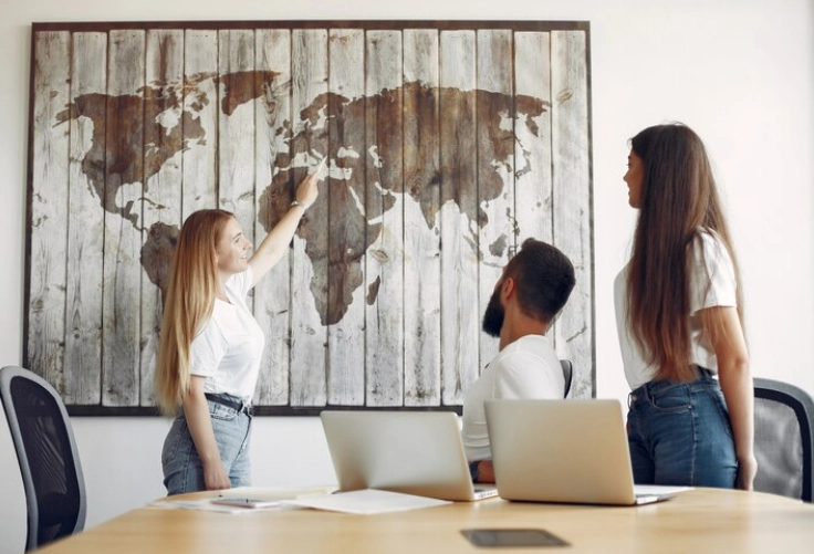 During a training workshop for adventure travel, the staff actively engaged in the map on the wall.