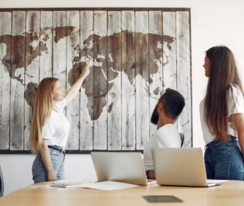 During a training workshop for adventure travel, the staff actively engaged in the map on the wall.